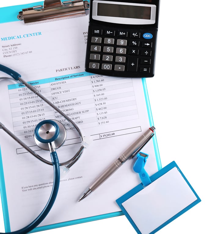 Stethoscope with Medical Bill and Calculator Isolated on White